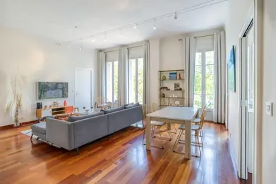 a living room with a couch and a table at #27 Urban Suite AC 2 Bedrooms 10mins Walk Sea&Old Town in Nice
