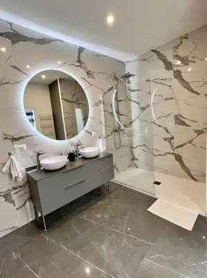 a bathroom with two sinks and a mirror at Magnifique loft au cœur de Nice in Nice