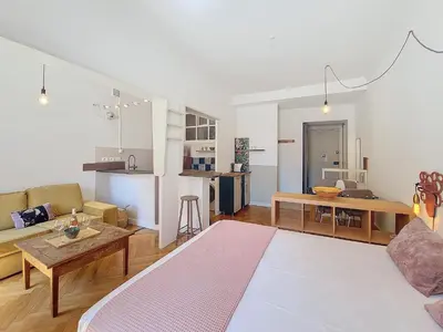 a living room with a couch and a table at Nestor&Jeeves - CITY TRIP - Central - Balcony in Nice