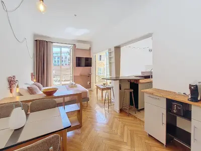 a kitchen and living room with a table and a dining room at Nestor&Jeeves - CITY TRIP - Central - Balcony in Nice