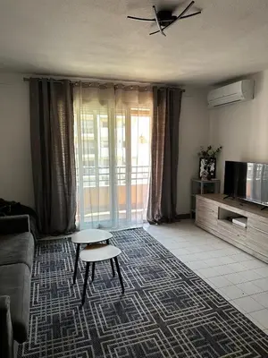 a living room with a couch and a table at Californie in Nice