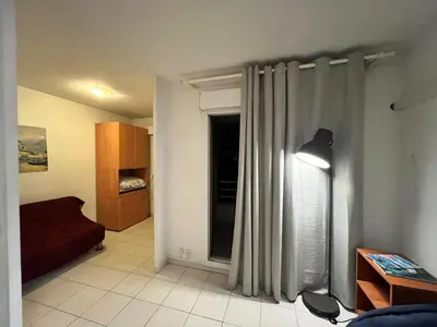 a living room with a bed and a window at Magnifique 2 pièces centre Nice in Nice
