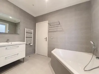 a bathroom with a white tub and a sink at Nestor&Jeeves - BRISE DE NICE - Balcony - Central in Nice