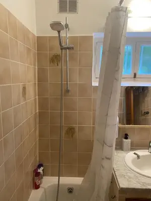 a bathroom with a shower and a sink at L'Oustalet in Nice