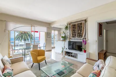 a living room with a couch and a tv at Nice Absea le Port 1 in Nice