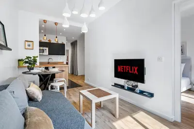 a living room with a couch and a table at Nice Renting - ROSSETTI - Modern Haven Heart of Old Nice in Nice
