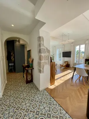 a living room with white walls and wooden floors at Bright, Spacious 2 Bedroom Apartment, Walk to Beach & Old Town in Nice
