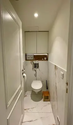 a bathroom with a white toilet in a room at Bright, Spacious 2 Bedroom Apartment, Walk to Beach & Old Town in Nice