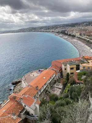 an aerial view of a beach with buildings and the water at Wunderschöne Wohnung in Jugendstilvilla am Hafen in Nice