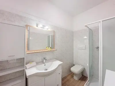 a white bathroom with a sink and a toilet at Nestor&Jeeves - VILLA FAY - Near Beach - Promenade in Nice