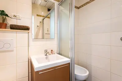 a bathroom with a sink and a toilet at Royal Luxembourg AP4397 By Riviera Holiday Homes in Nice