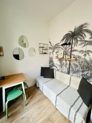 a living room with a couch and a table at All new charming 1br hyper centre with balcony and AC in Nice