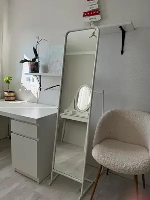 a mirror sitting next to a desk and a chair at Anahit in Nice