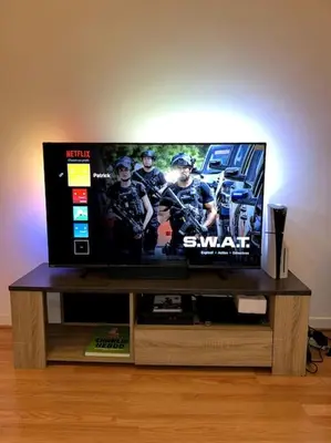 a flat screen tv sitting on top of a table at Charmant studio avec mezzanine in Nice