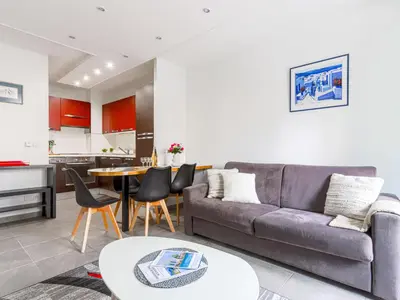 a living room with a couch and a table at Apartment Jardin Pastorelli by Interhome in Nice
