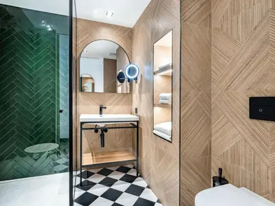 a bathroom with a sink and a shower at Doubletree By Hilton Nice Centre Iconic in Nice