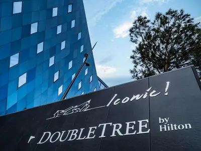 a sign in front of a building at Doubletree By Hilton Nice Centre Iconic in Nice