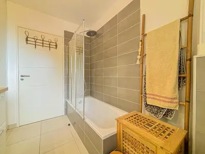 a bathroom with a shower and a bath tub at Canta Galet - Wifi, AC, Parking, 4pers in Nice