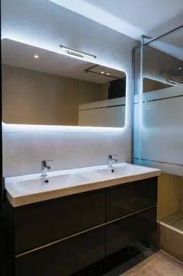 a bathroom with a sink and a mirror at Prestigieuse Villa De Crémat Nice in Nice