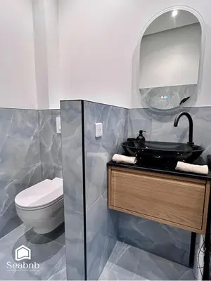 a bathroom with a sink and a toilet at Luxurious Apartment - Seaside - Spa Bath - WiFi - AC in Nice
