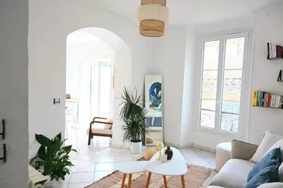 a living room with a couch and a table at The Seaside Serenity -NEW AC equipped - Calm with Bay View - Heart of Villefranche in Villefranche-sur-Mer