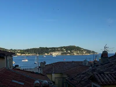 a view of a harbor with boats in the water at The Seaside Serenity -NEW AC equipped - Calm with Bay View - Heart of Villefranche in Villefranche-sur-Mer