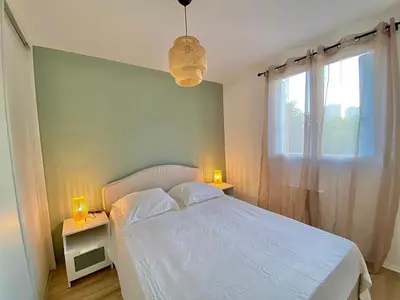 a bedroom with a white bed and two night stands at Modern & Cosy 3 Bedrooms train tramway in Nice