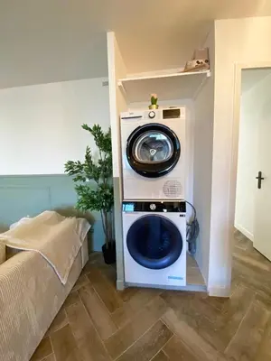 a washer and dryer sitting in a room at Modern & Cosy 3 Bedrooms train tramway in Nice