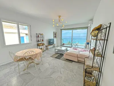 a living room with a view of the ocean at Milord Promenade 4 in Nice