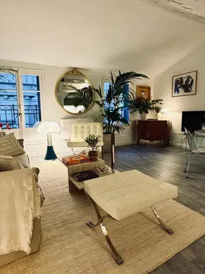 a living room with a couch and a table at Superbe duplex entre le Vieux Nice et la Prom in Nice