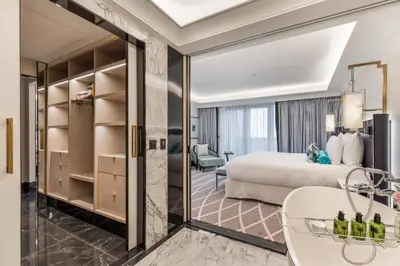 a hotel room with a bed and a bathroom at Maison Albar - Le Victoria in Nice