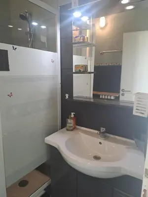 a bathroom with a white sink and a mirror at La bella vista in Nice