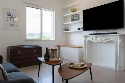 a living room with a fireplace and a flat screen tv at #54 Sea view Villa 4 BDR AC 5mins to Port BBQ in Nice