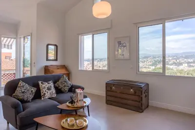 a living room with a couch and a table at #54 Sea view Villa 4 BDR AC 5mins to Port BBQ in Nice