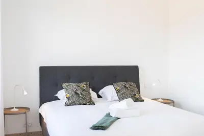 a bedroom with two beds with white sheets and pillows at #54 Sea view Villa 4 BDR AC 5mins to Port BBQ in Nice