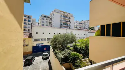 a view from a balcony of a city with buildings at Super logement - Mer à 5 min à pieds ! in Nice