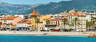 a view of a beach with buildings and a city at face à la mer in Cros-de-Cagnes