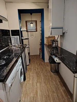 a kitchen with a stove and a washer and dryer at Movida in Nice