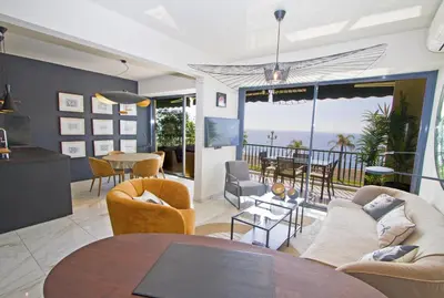 a living room with a view of the ocean at Luxury Flat Beachfront Nice in Nice