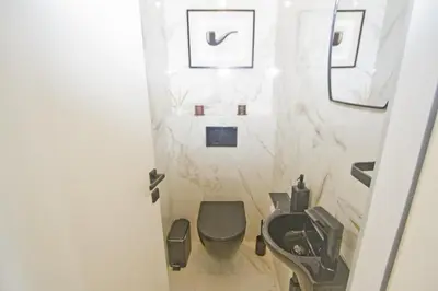 a bathroom with a toilet and a sink at Luxury Flat Beachfront Nice in Nice