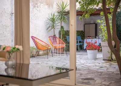a view of a patio with chairs and plants at Charmant 4 pièces - Cour privative - Port de Nice in Nice