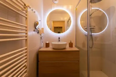 a bathroom with a sink and a mirror at Nice SuiteMarie Carre d'or in Nice
