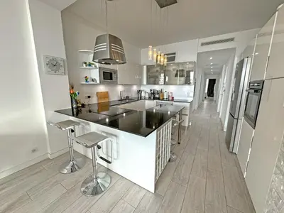 a kitchen with a large island in a room at Gorgeous Oceanfront Apartment Promenade in Nice