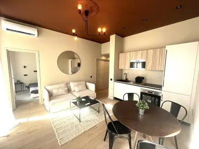 a living room with a couch and a table at Beaumont republique in Nice