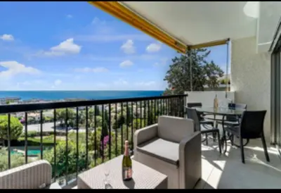 a balcony with a view of the ocean at Magnificent 3 Rooms-Sea View-Terrace-Pool in Nice