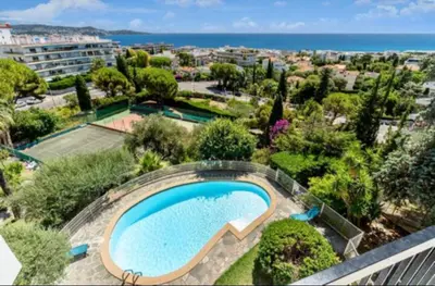 an overhead view of a swimming pool in a resort at Magnificent 3 Rooms-Sea View-Terrace-Pool in Nice