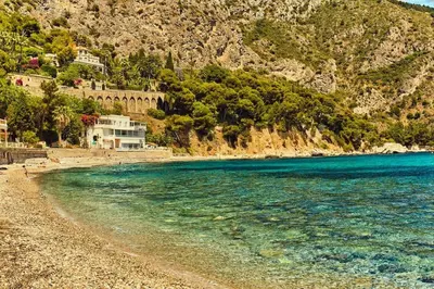 a beach with blue water and a mountain at Best View ever! in Èze