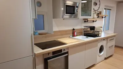 a kitchen with white cabinets and a sink and a dishwasher at Historic Bright and Beautiful Apartment in Old Nice with Castle Hill View in Nice