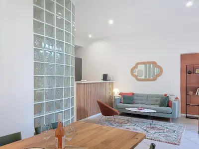 a living room with a couch and a table at Nestor&Jeeves - BEL AIR - City Center - Modern in Nice