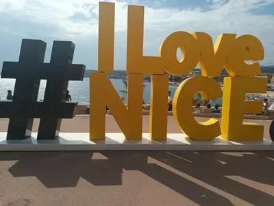 a sign for the word love on the beach at Very Nice Apartment in Nice